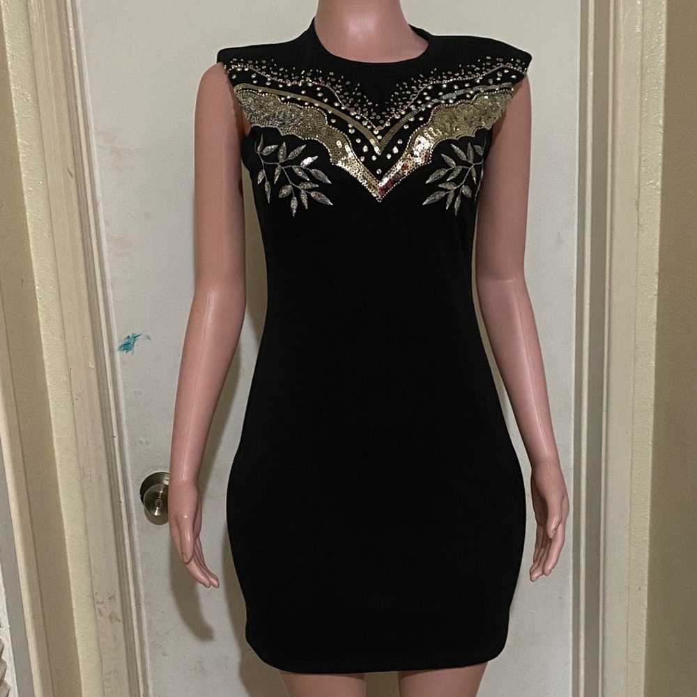 Chic Black Dress with Gold Accents